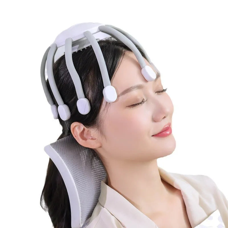 Black and white head massager with multiple claws and USB charging port showing four vibration mode settings