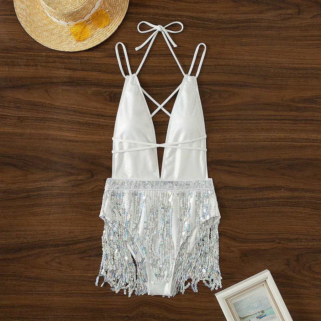 White one-piece swimsuit with deep V-neck and tassel detail, sleeveless briefs style