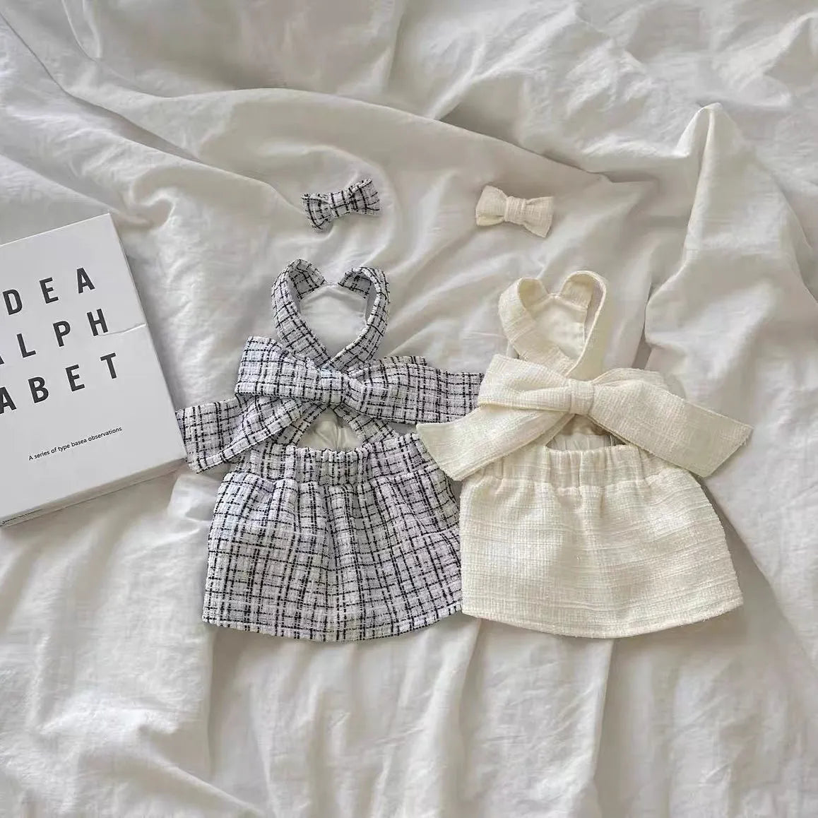 Cotton sling skirt dog clothing in black and white or white, sizes XS to XL