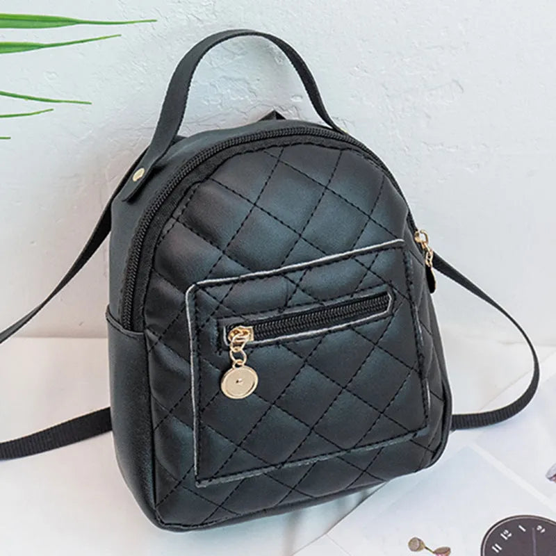 Girls square hard PU backpack with embroidery detail in black, pink or white, showing soft handle and outer pocket.