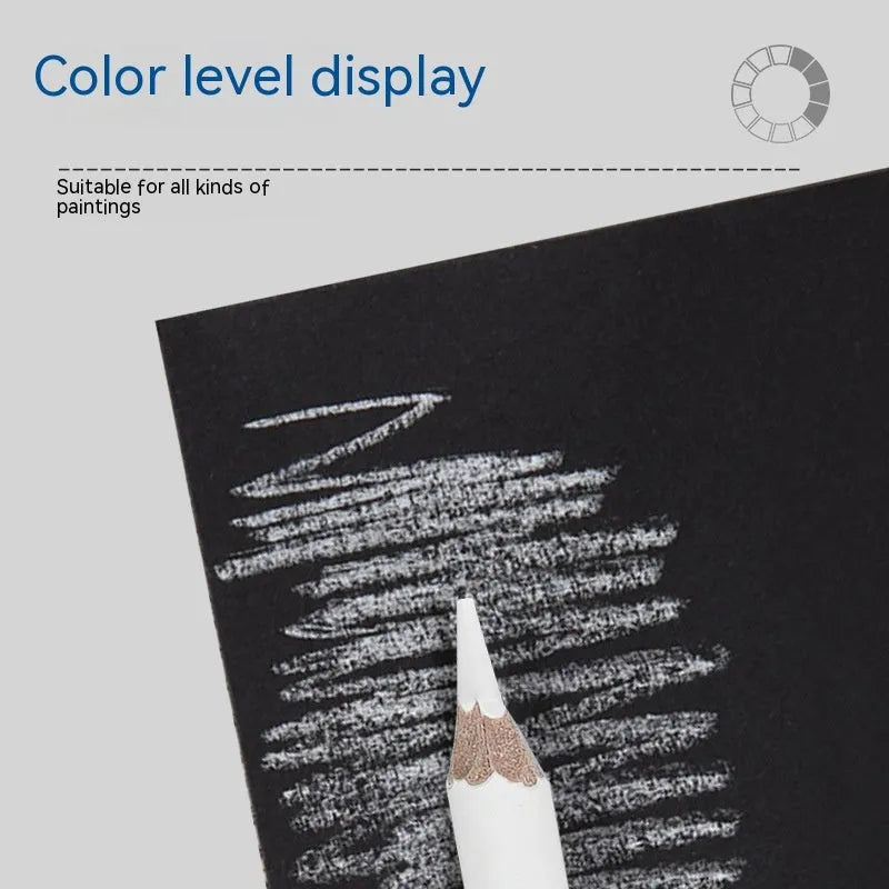 Three white charcoal pencils in wooden casings for drawing highlights on dark paper