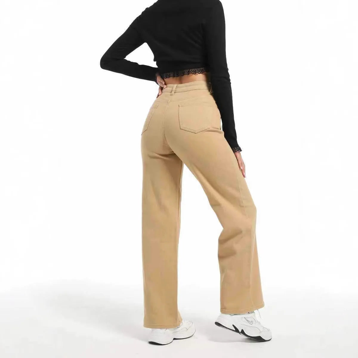 Women's high-waist wide-leg jeans in apricot colour, laid flat to show straight leg cut.