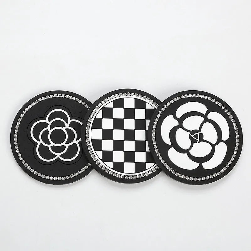 Plastic universal car cup holder mat in a black and white checkerboard pattern