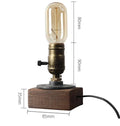 Industrial water pipe table lamp in wood and black iron measuring 9cm wide by 13cm high