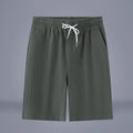 Chinese style solid colour cotton linen cropped pants with a drawstring waist, shown in Army Green.