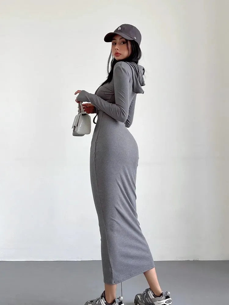A woman's long sleeve hooded sheath dress in polyester, showing the high waist and over-the-knee length.