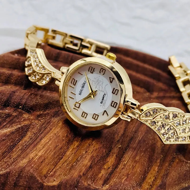 Round stainless steel women's watch with gold dial surface and Vachette clasp buckle