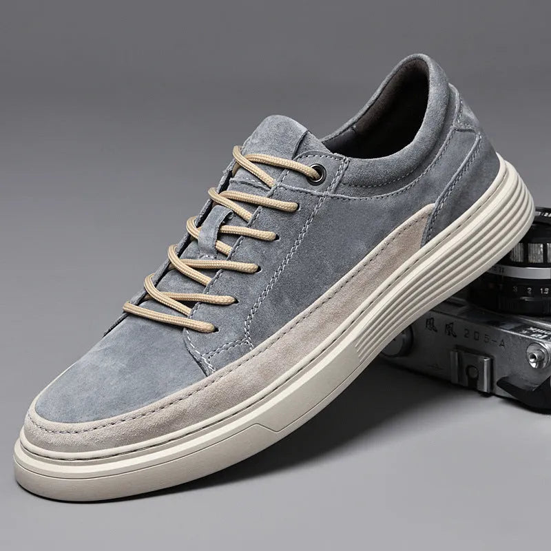 Men's grey casual skate shoes with pigskin upper and rubber sole on white background
