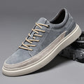 Men's grey casual skate shoes with pigskin upper and rubber sole on white background