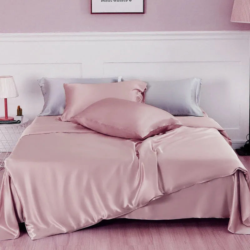 Double-sided silk duvet cover showing reversible solid colours in lotus pink and pea green options