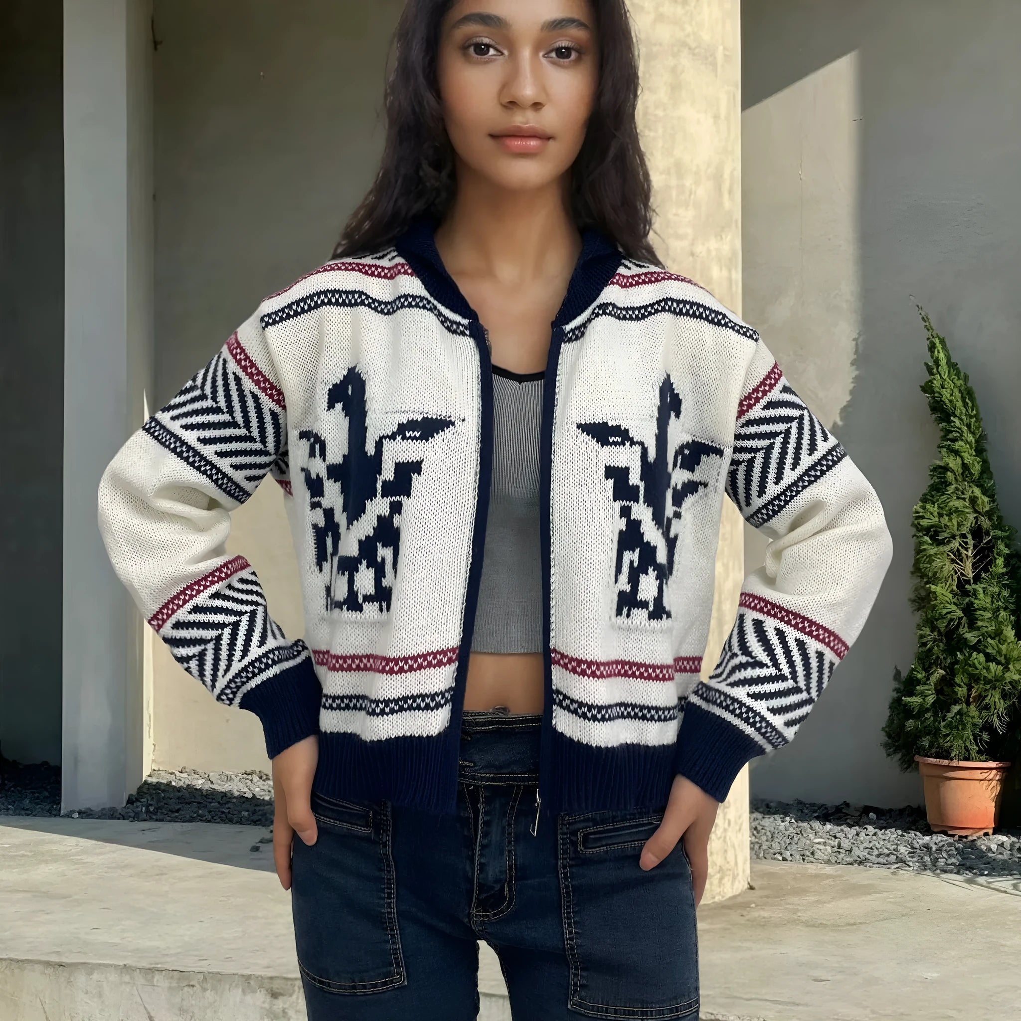 White women's zip-front cardigan sweater with a contrasting jacquard lapel and stripe pattern.