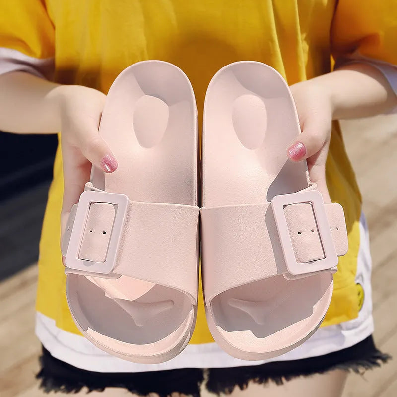 Women's grey blue EVA buckle sandals with an adjustable strap on a white background.