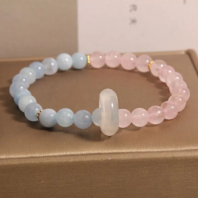 Women's aquamarine crystal bracelet set with pink beads and mixed materials in dopamine colours