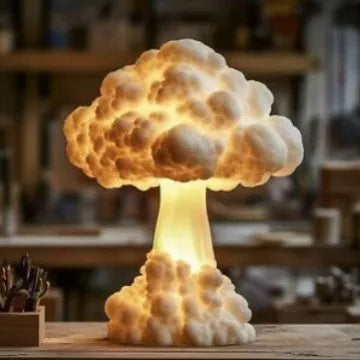 Atomic bomb explosion mushroom cloud shaped USB table lamp on a desk.