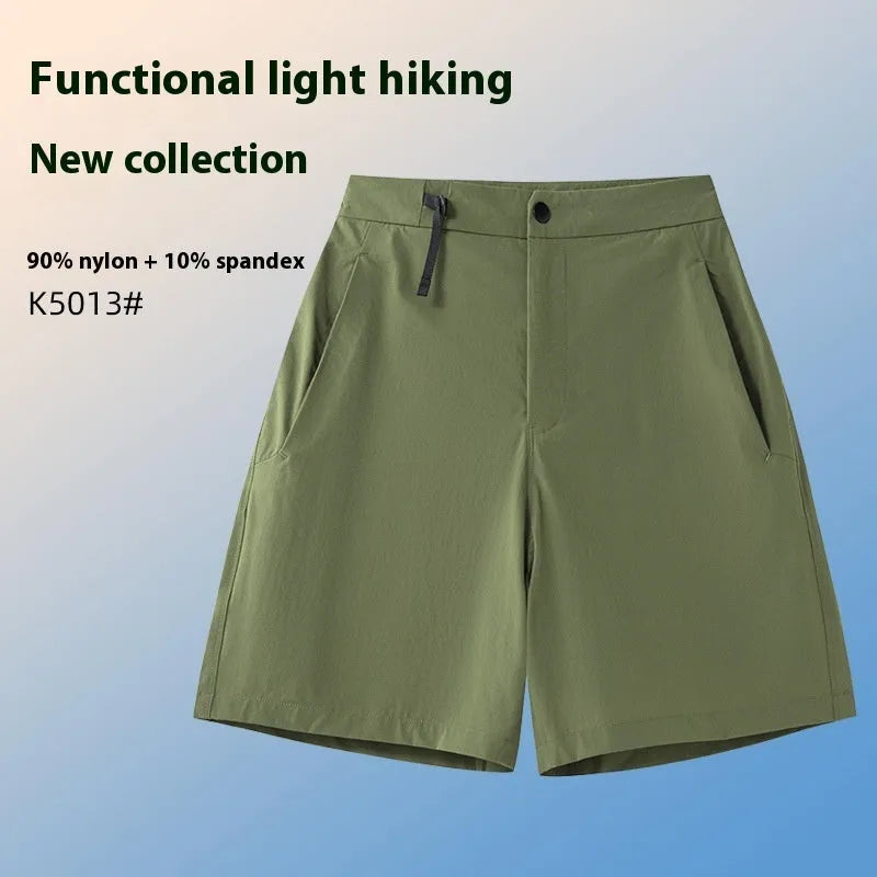 Men's solid colour sport shorts with elastic waistband, shown in army green, for running and climbing activities.