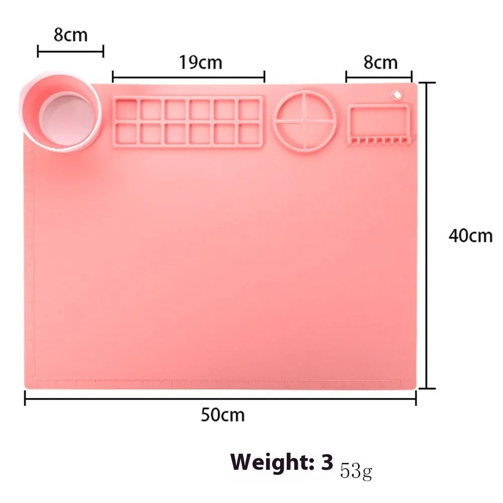 Light blue silicone painting mat with two built-in bowls, sized 50 by 40 centimetres.