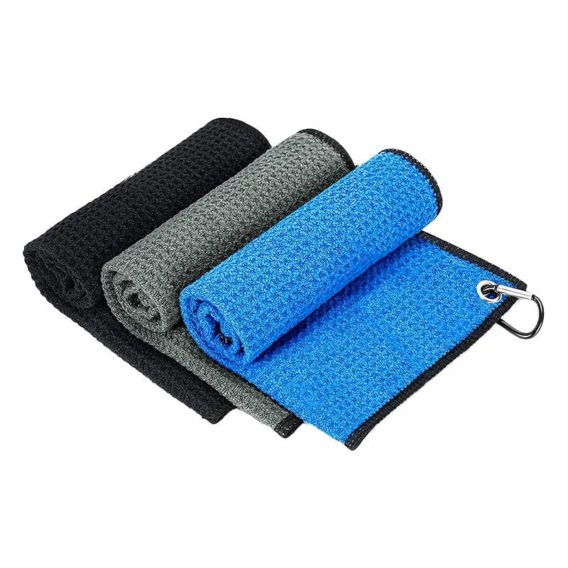 Waffle weave golf ball cleaning cloth in blue, showing textured surface and rectangular shape.