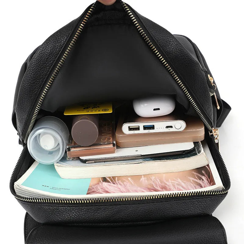 Casual women's backpack in soft PU leather with textured detailing and three-dimensional pockets