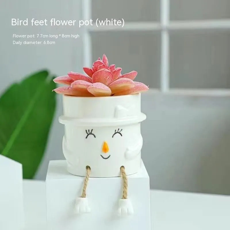 Ceramic hanging foot flowerpot in cartoon style for succulent plants on desktop