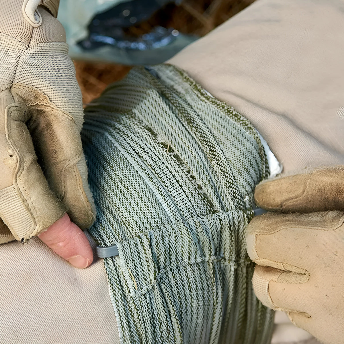 Packaged roll of tactical hemostatic gauze bandage showing 10cm and 15cm size options.