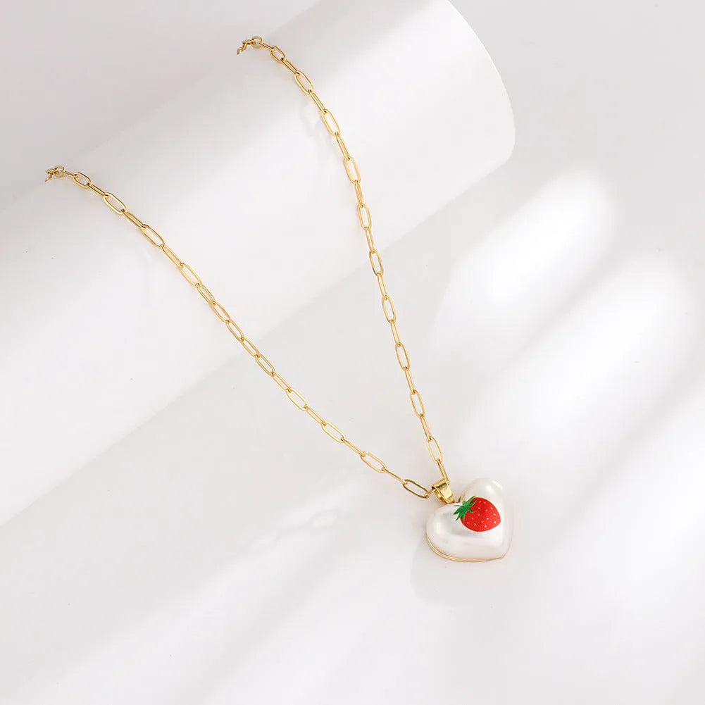 Girl's adjustable necklace with a heart and geometric fruit charms on a chain