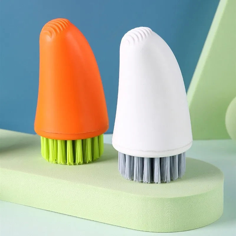 Carrot-shaped orange kitchen brush with nylon bristles for cleaning vegetables