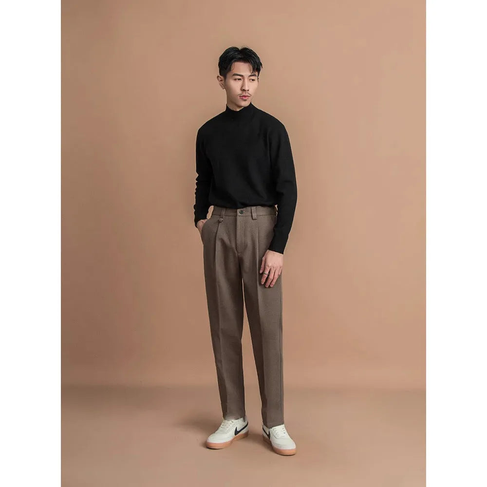 Men's straight leg polyester trousers in black, shown laid flat to display the cut and drape.