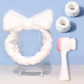 Facial brush set with coral fleece hair band, nylon brush heads, and plastic handle in purple, gray, white, or pink colours