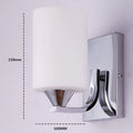 Chrome-finished wall lamp with glass shade in single head and double head configurations.