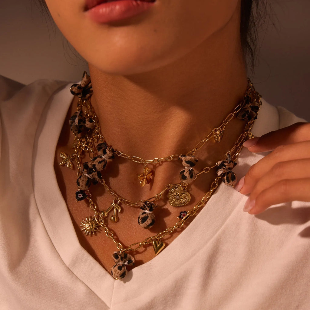 Stainless steel necklace with geometric leopard pendant featuring love heart flowers