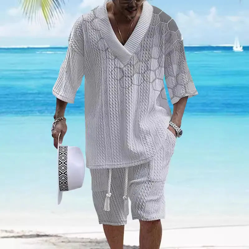 Man wearing a printed drop-shoulder knitted short sleeve top with matching shorts, a casual two-piece loungewear set.
