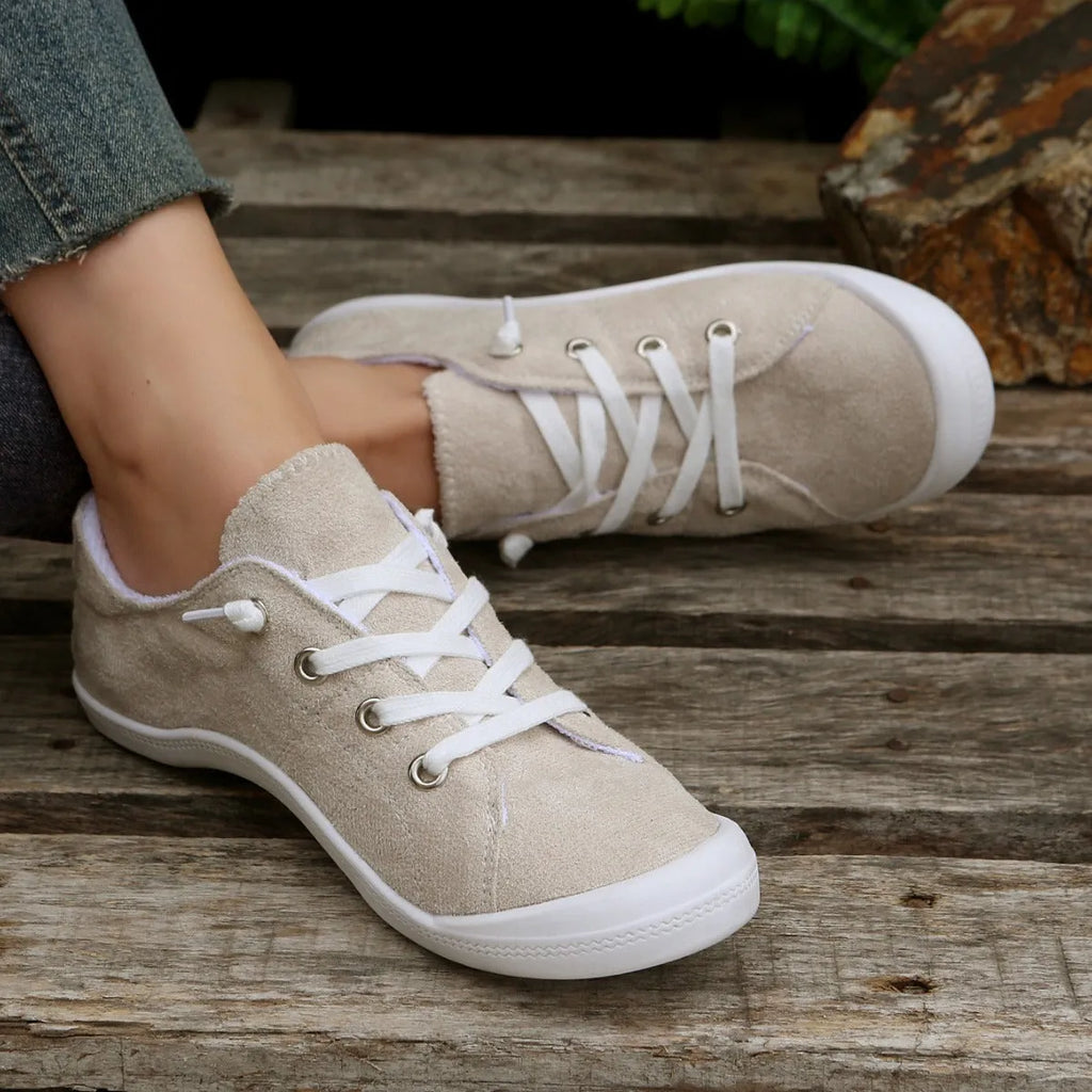 Women's creamy white casual sneakers with fabric upper and rubber sole