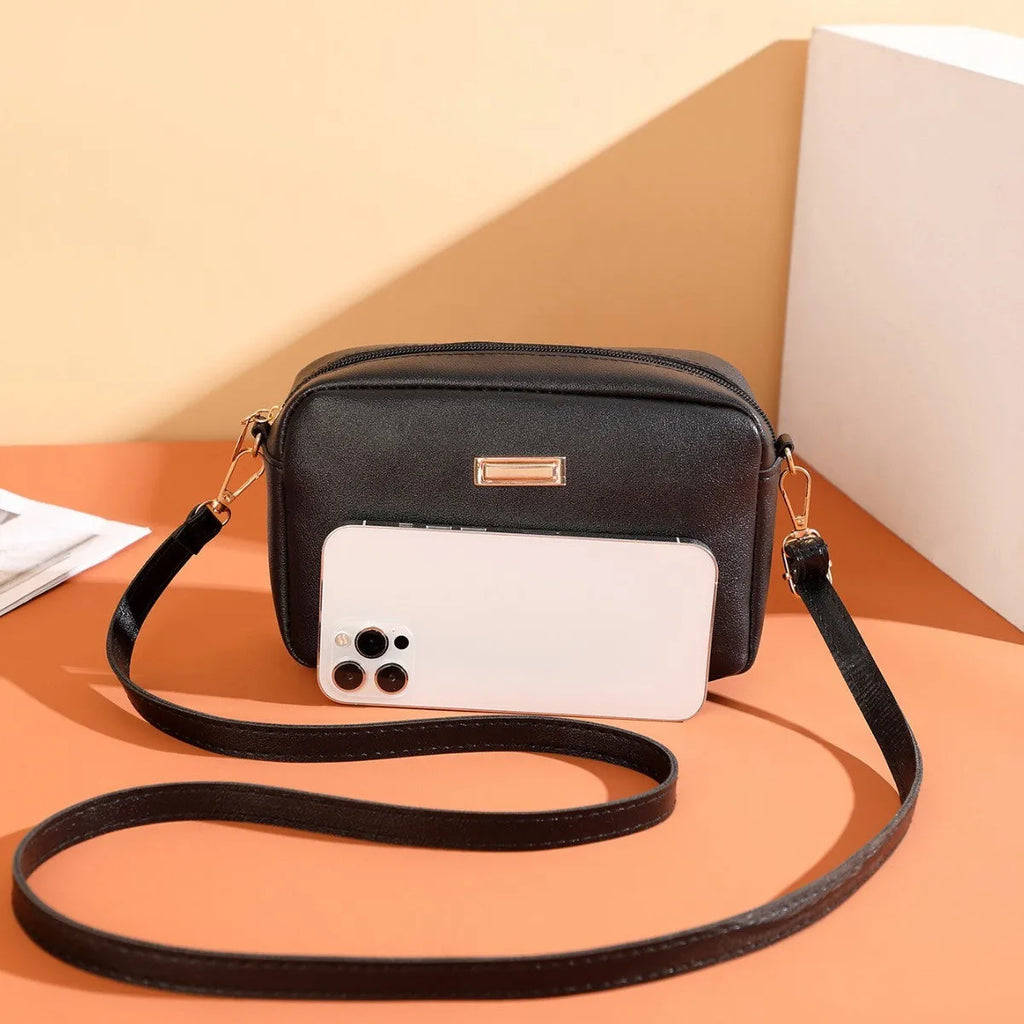 Women's solid colour PU shoulder bag with three-dimensional pocket in urban simplicity style