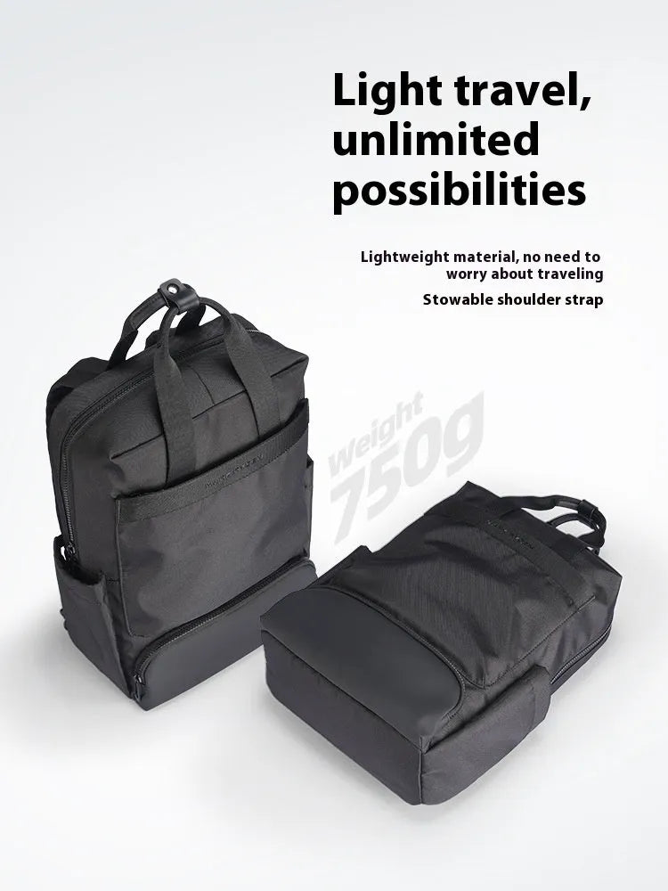 Black Oxford cloth computer backpack showing main compartment and 20-35 litre capacity.