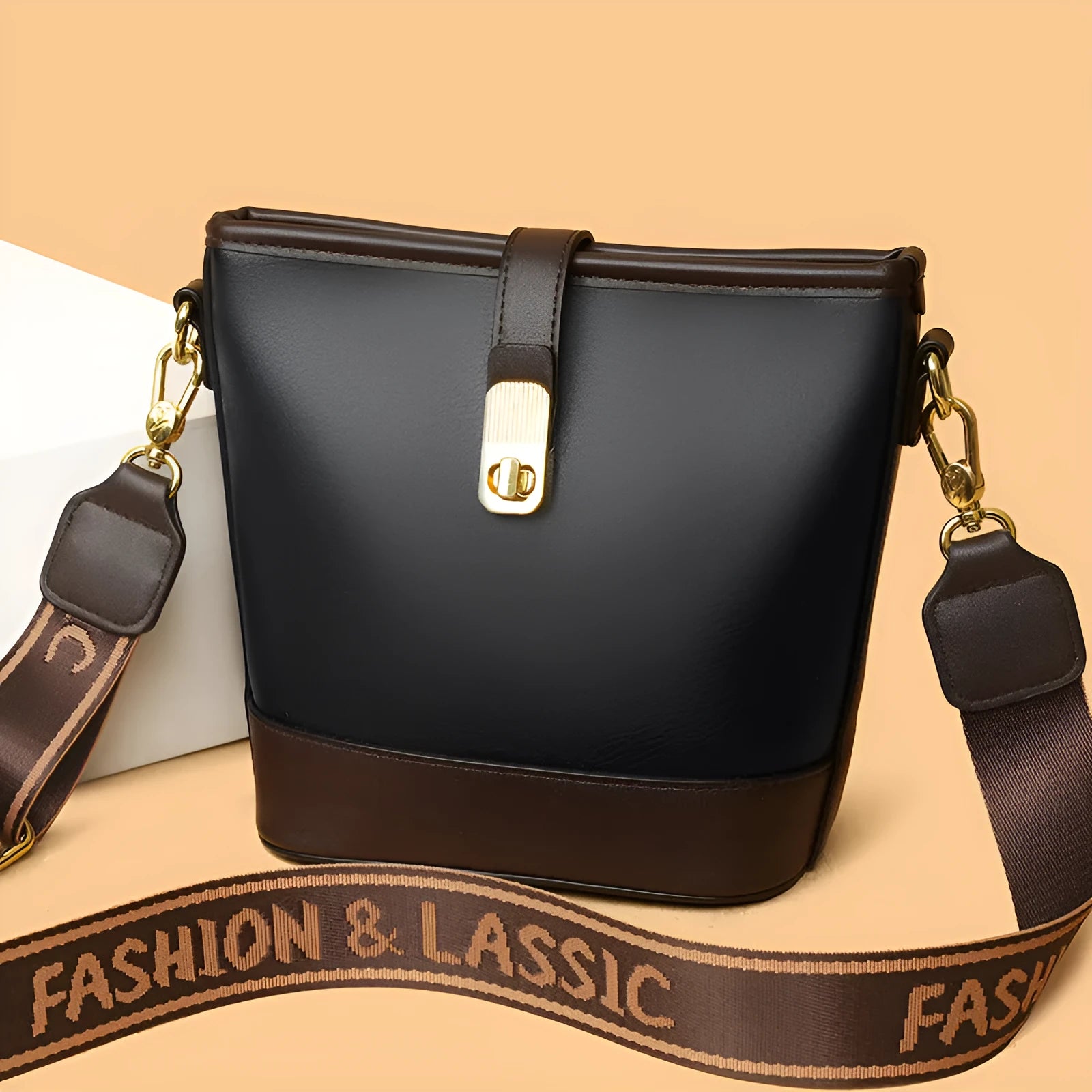 Soft black PU bucket style messenger bag with double shoulder straps, shown open to reveal internal organiser pockets.