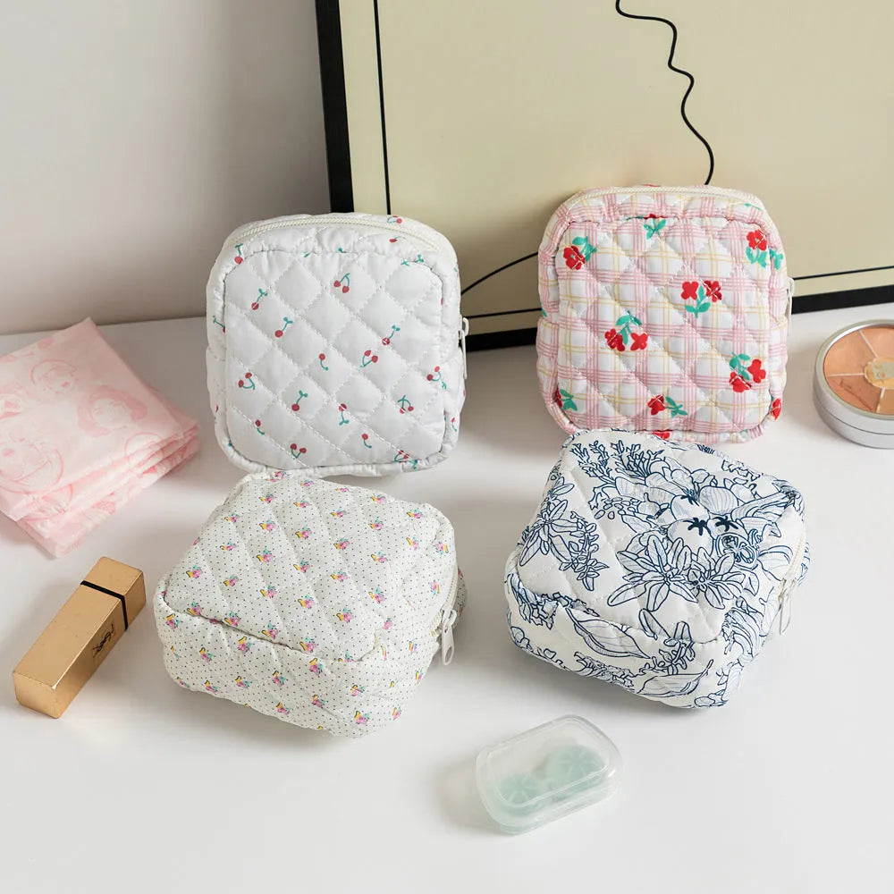 Polyester women's key storage bag with floral pattern choices on white background.