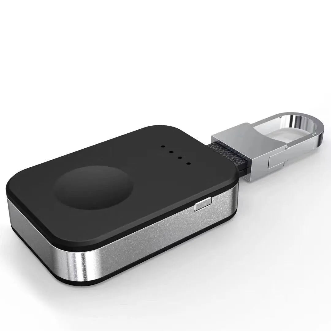 Black ABS Apple Watch wireless charging power bank on a keyring, shown next to an Apple Watch.