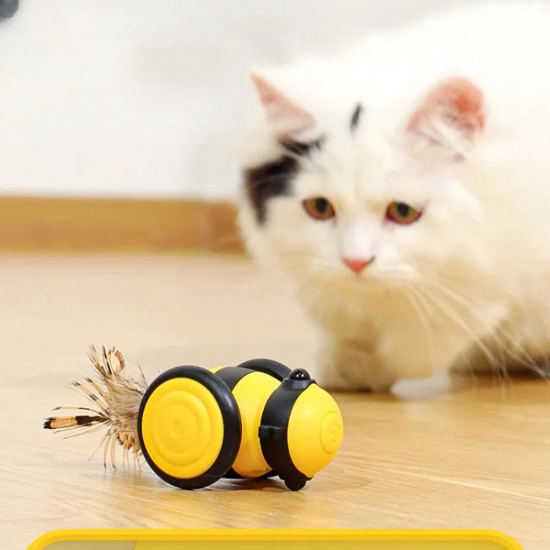 Pink electric cat toy with moving stick and feather teaser for kittens