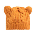 Hand-knitted red wool beanie with 3D cat ears on adult model in winter setting