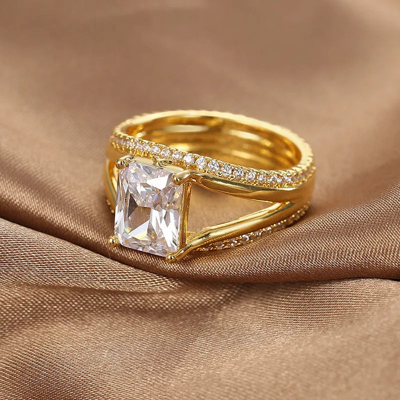 Gold coloured geometric women's ring with square zircon detailing on copper with electroplated finish