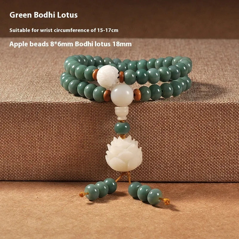 Bodhi seed beaded bracelet with a double ring safety buckle clasp featuring a Lotus detail.