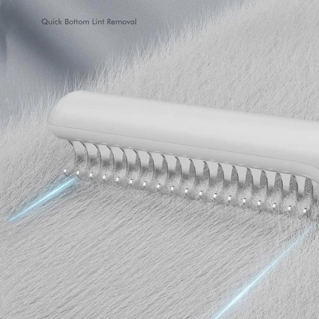 Stainless steel pet dematting comb with ergonomic handle in pink colour.
