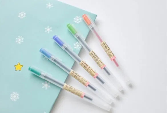 12 black Muji gel pens with 0.5mm fine tips showing ink prevention mechanism and aqueous ink labelling
