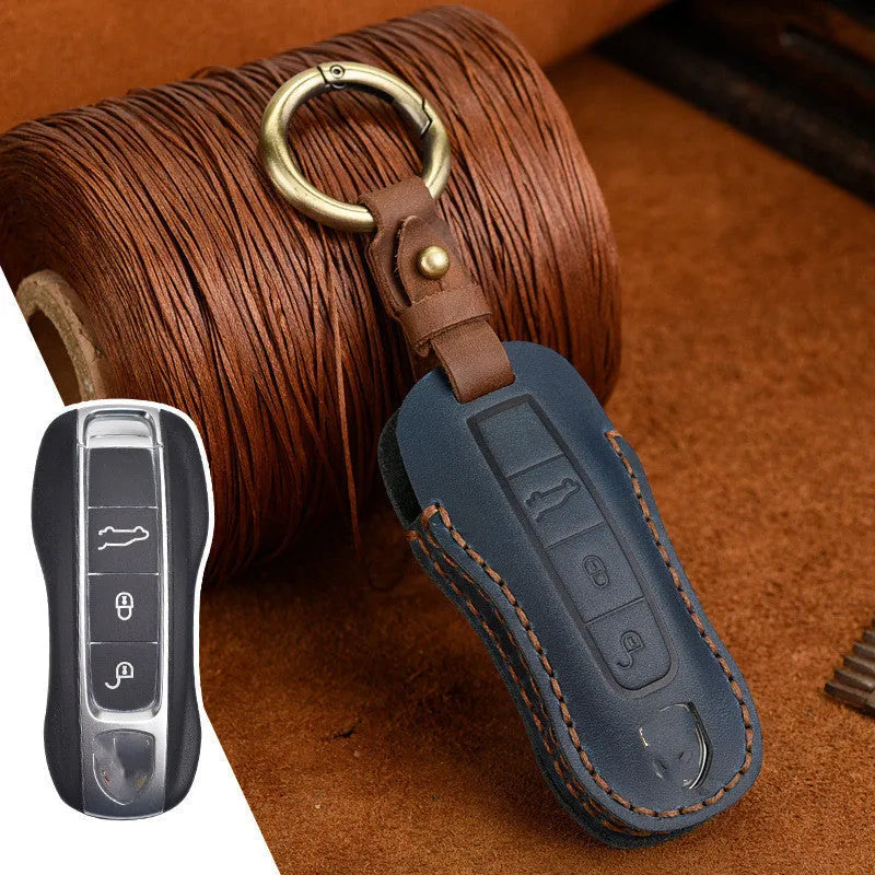 Genuine cowhide leather Porsche key cover in retro bag buckle style, blue and brown colour options.
