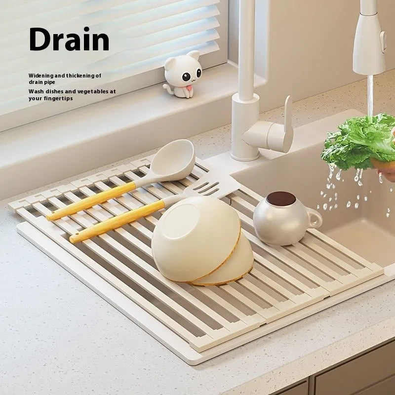 Milky white foldable stainless steel kitchen draining rack over a sink.