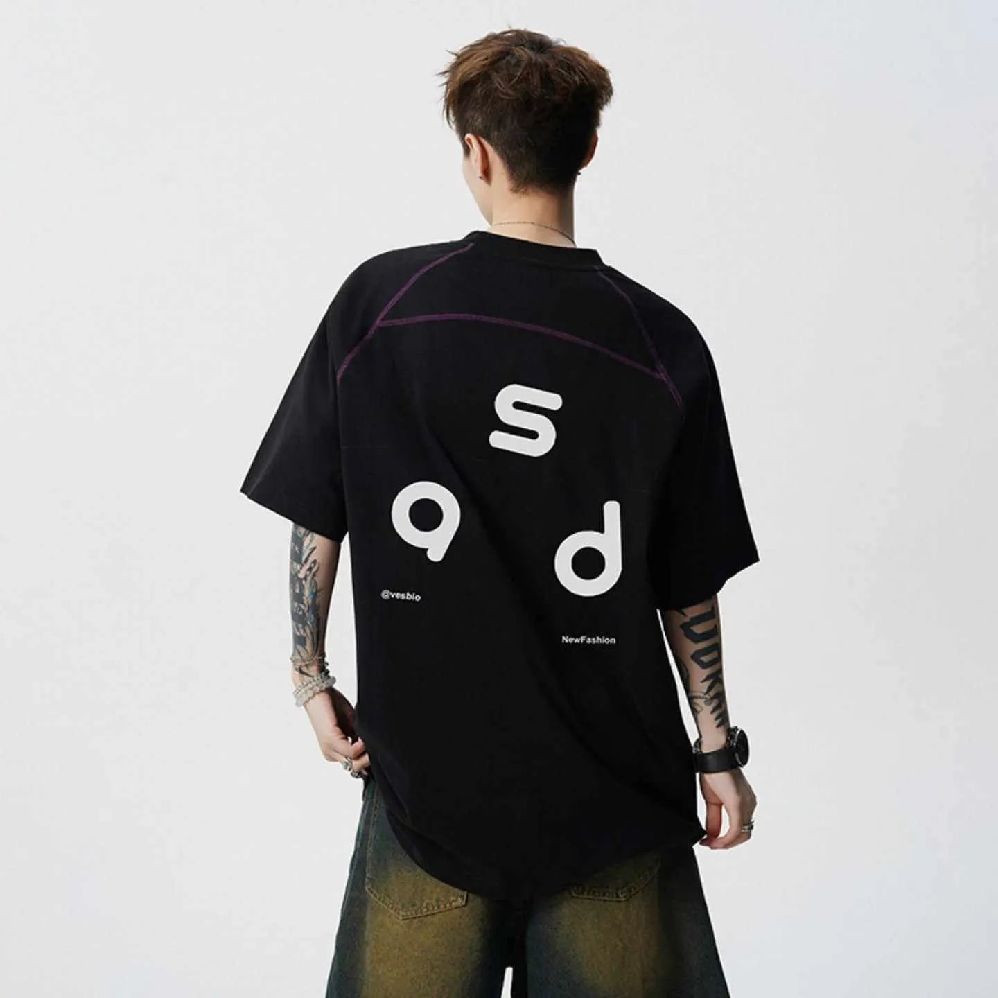 Men's black cotton t-shirt with white letter print, short sleeves, and a round neck.
