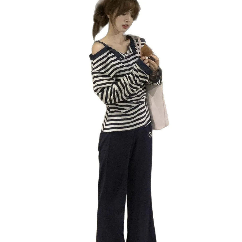 Dark blue Korean-style oversized women's long-sleeved t-shirt with stripes and embroidery detail.