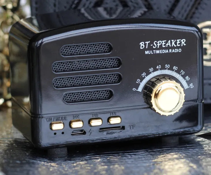 Vintage wood finish Bluetooth speaker in compact plastic housing with USB charging port