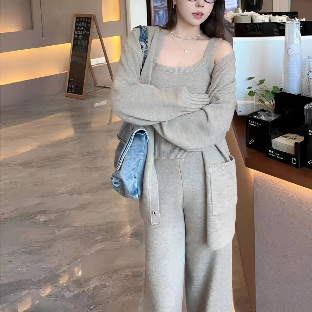 Women's loose-fit knit cardigan, vest, and trousers three-piece set in wool blend fabric.