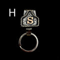 Handmade metal cow tag belt keychain in one of 26 available colours.